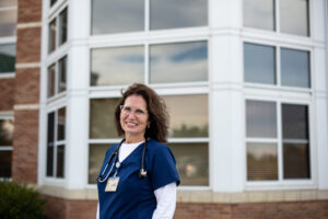 For patients leaving the hospital that still need care, Karen Neeb, a nurse practitioner at Michigan Medicine, provides them with home monitoring kits. Image credit: Eric Bronson, Michigan Photography