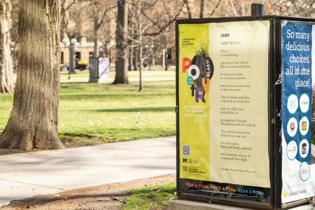 Photo of a display on the Central Campus Diag that is one of more than 30 “pop-up poems” around campus and downtown Ann Arbor that are part of the monthlong “Poetry Blast” exhibition. 