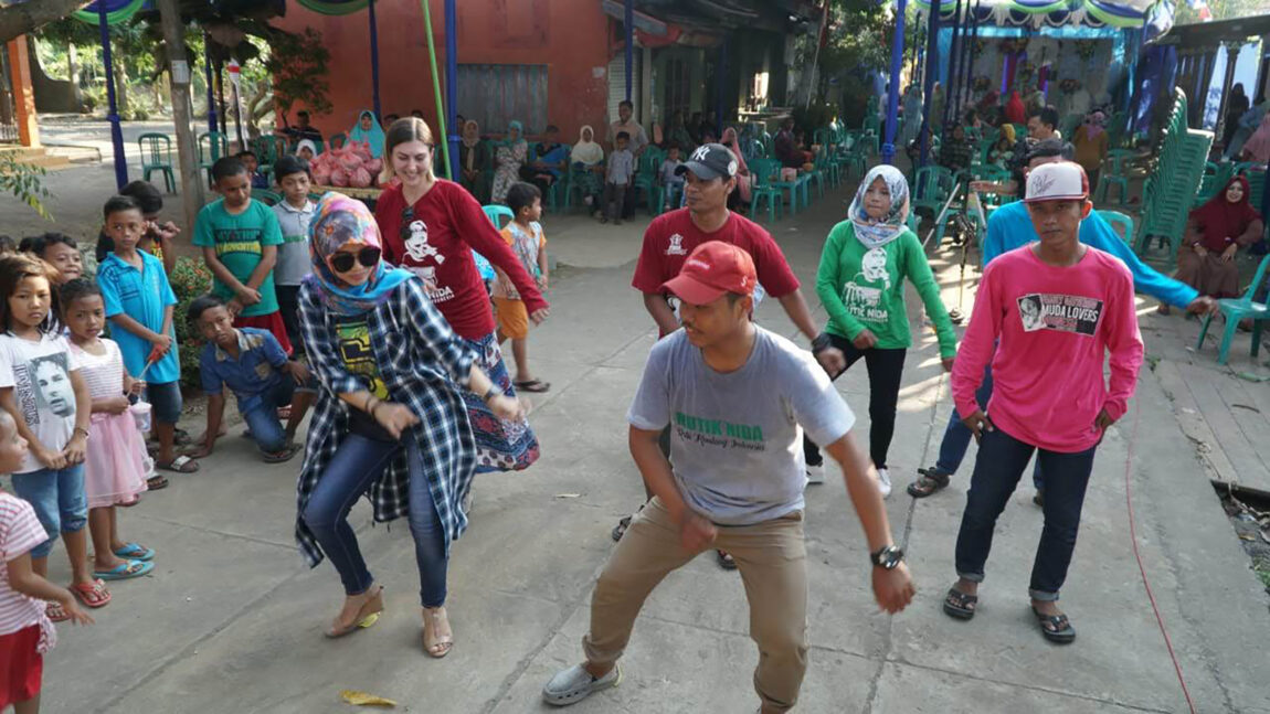 Rebecca Selin (back row, left), a graduate student in the Center for World Performance Studies, dances while on a research trip in Indonesia during the summer of 2018. (Photo courtesy of the Center for World Performance Studies)