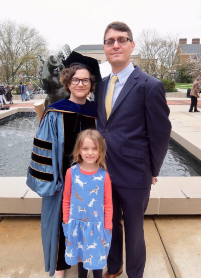 Kate Wroblewski is shown with her husband, Chad Weeks, and their daughter, Zofia, at Ingalls Mall during Rackham Graduate School commencement exercises in 2018. Wroblewski is a lecturer III in history in LSA and assistant director of undergraduate studies. (Photo courtesy of Kate Wroblewski)