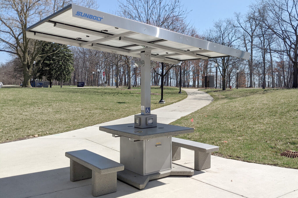 This solar-powered charging table near the North Campus Recreation Building is one of two new such sites on the Ann Arbor campus.