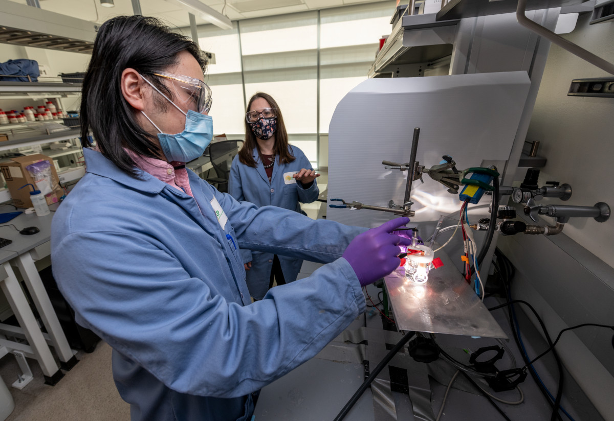 Two scientists, Francesca Toma (right) and Guosong Zeng, in a lab working on artificial photosynthesis.