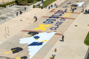 The University of Michigan commencement mural honors the U-M Class of 2021 and was 29 undergraduate students from the U-M Penny W. Stamps School of Art & Design. It is located on the street outside of the Rackham Graduate School (915 E. Washington Street), between Thayer and Fletcher Streets. Image credit: Scott Soderberg, Michigan Photography