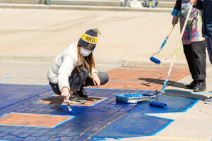 The University of Michigan commencement mural honors the U-M Class of 2021 and was 29 undergraduate students from the U-M Penny W. Stamps School of Art & Design. It is located on the street outside of the Rackham Graduate School (915 E. Washington Street), between Thayer and Fletcher Streets. Image credit: Scott Soderberg, Michigan Photography
