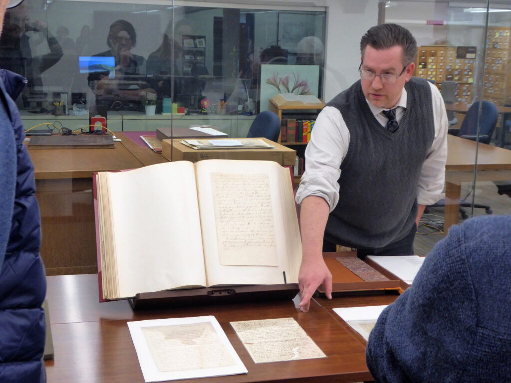 Cheney Schopieray, curator of manuscripts at the Clements Library, points to Thomas Gage’s original draft of his order to seize military stores at the town of Concord, west of Boston, April 18, 1775. This expedition resulted in gunfire at Lexington and Concord—the hostilities that began the fighting war of the American Revolution War. Photograph taken at the William L. Clements Library, November 15, 2018.