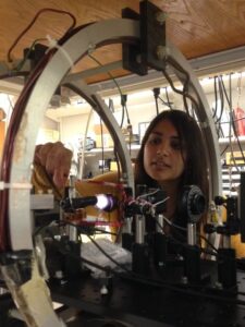 U-M graduate student Midhat Farooq in the Chupp lab works on development of the 3He magnetometer used to confirm calibration of measurements of the storage ring magnetic field. Image credit: Chupp Lab