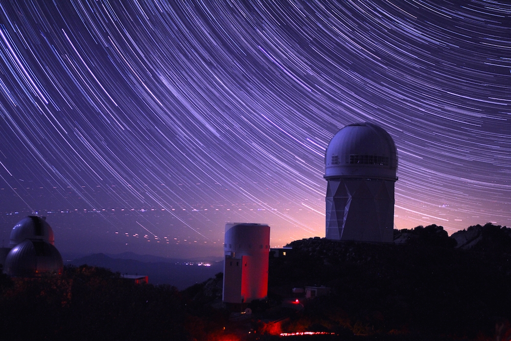 Star trails take shape around the 14-story Mayall Telescope dome in this long-exposure image. The Dark Energy Spectroscopic Instrument was installed inside this dome. Image credit: P. Marenfeld and NOAO/AURA/NSFStar trails take shape around the 14-story Mayall Telescope dome in this long-exposure image. The Dark Energy Spectroscopic Instrument was installed inside this dome. Image credit: P. Marenfeld and NOAO/AURA/NSF