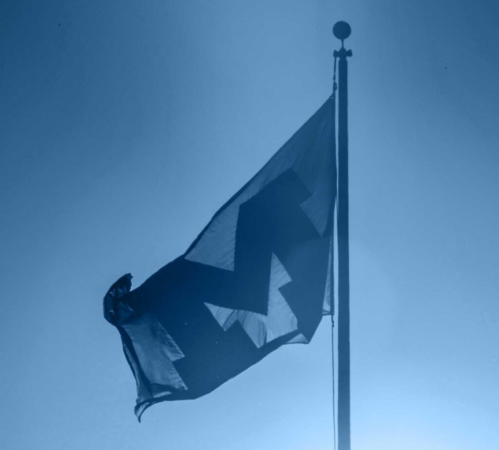 A flag with the Block M. Image credit: Austin Thomason, Michigan Photography