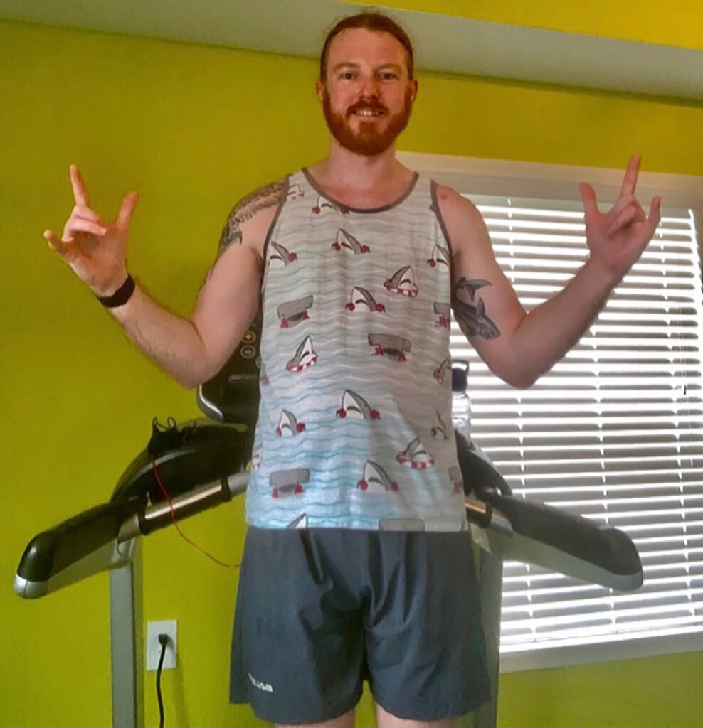Joshua Burd, building facilities manager with Student Life Housing Facilities, runs 10 miles a day, many times on his treadmill, and ran four half-marathons in the same week to raise awareness for the Maize & Blue Cupboard. (Photo courtesy of Joshua Burd)