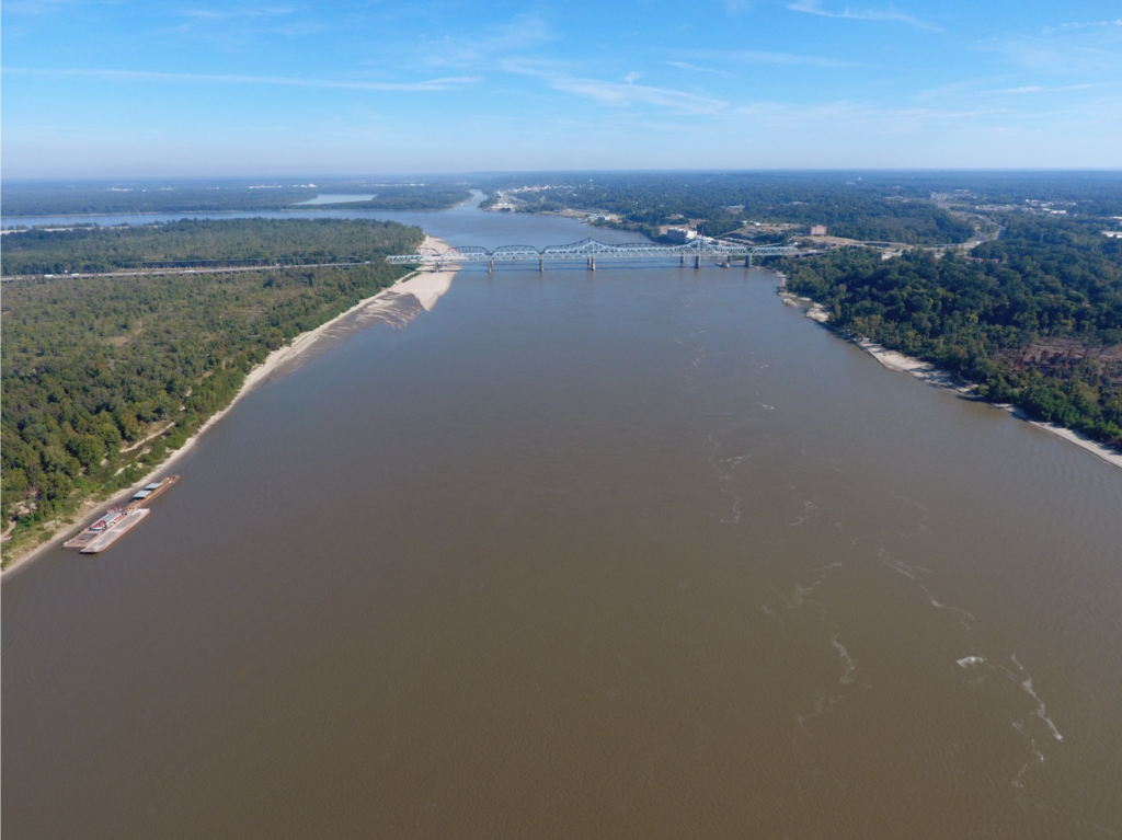 The Mississippi River near Vicksburg, looking Northeast at the Interstate 20 bridge, the confluence of the Yazoo River is in the foreground. The photo was taken by a drone flown by Jim Alvis and Mike Manning of the U.S. Geological Survey in the summer of 2016. Image credit: USGS