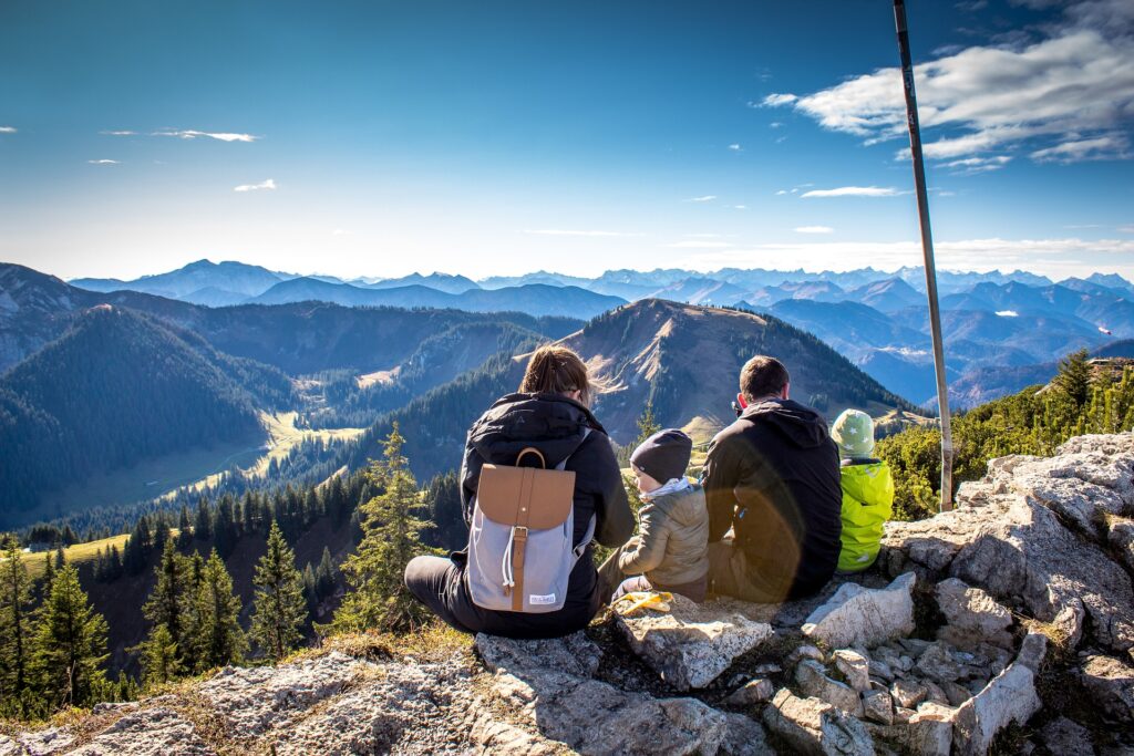 Family looking at mountains. Image credit: Pixabay