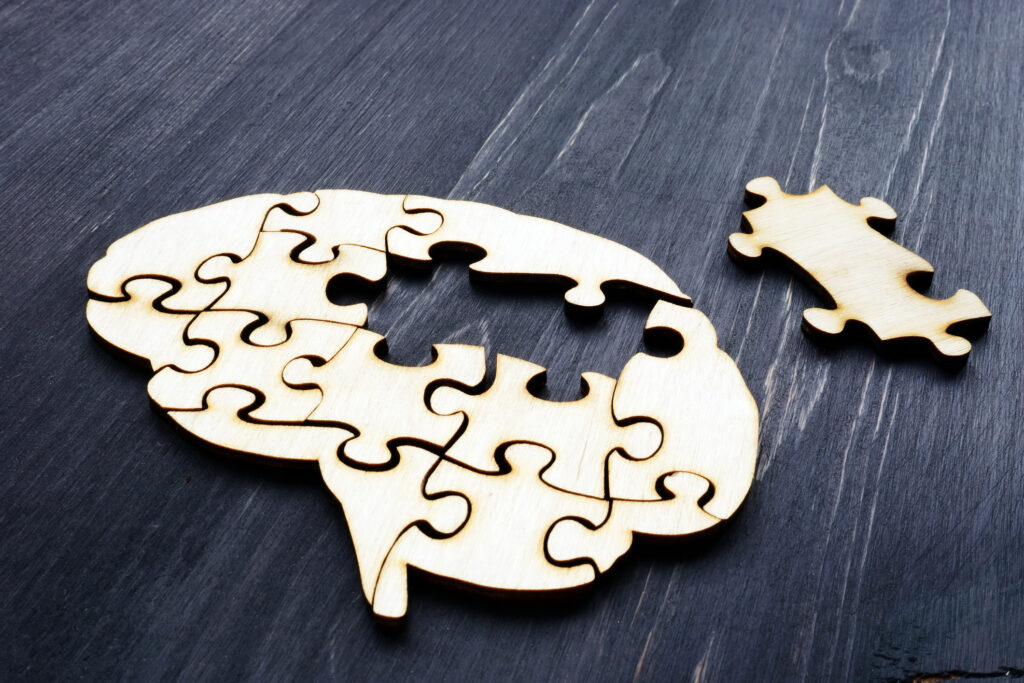 Brain from wooden puzzles. Mental Health and problems with memory. Image credit: iStock