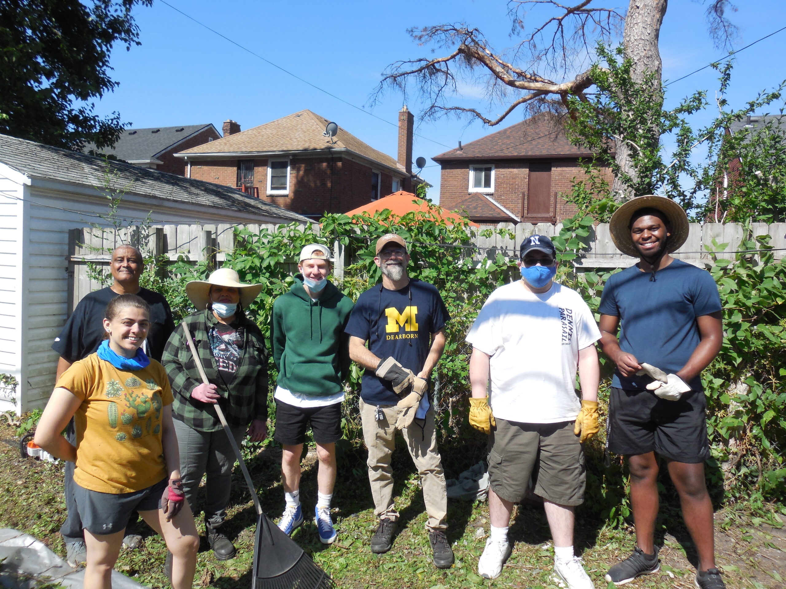 Alley cleanup in the west McNichols area. Pictured (left to right): Amina Mikula, UM-Dearborn student, Robert Turner, resident, Anne Peeples, resident, Solomon Draus, UD-Jesuit student, Charles “Chuck” Rivers, resident and president of the Neighborhood Association, Peyton Lynch, UM-Dearborn student, and Jacques Jones, UM-Dearborn student. Image courtesy: Paul Draus