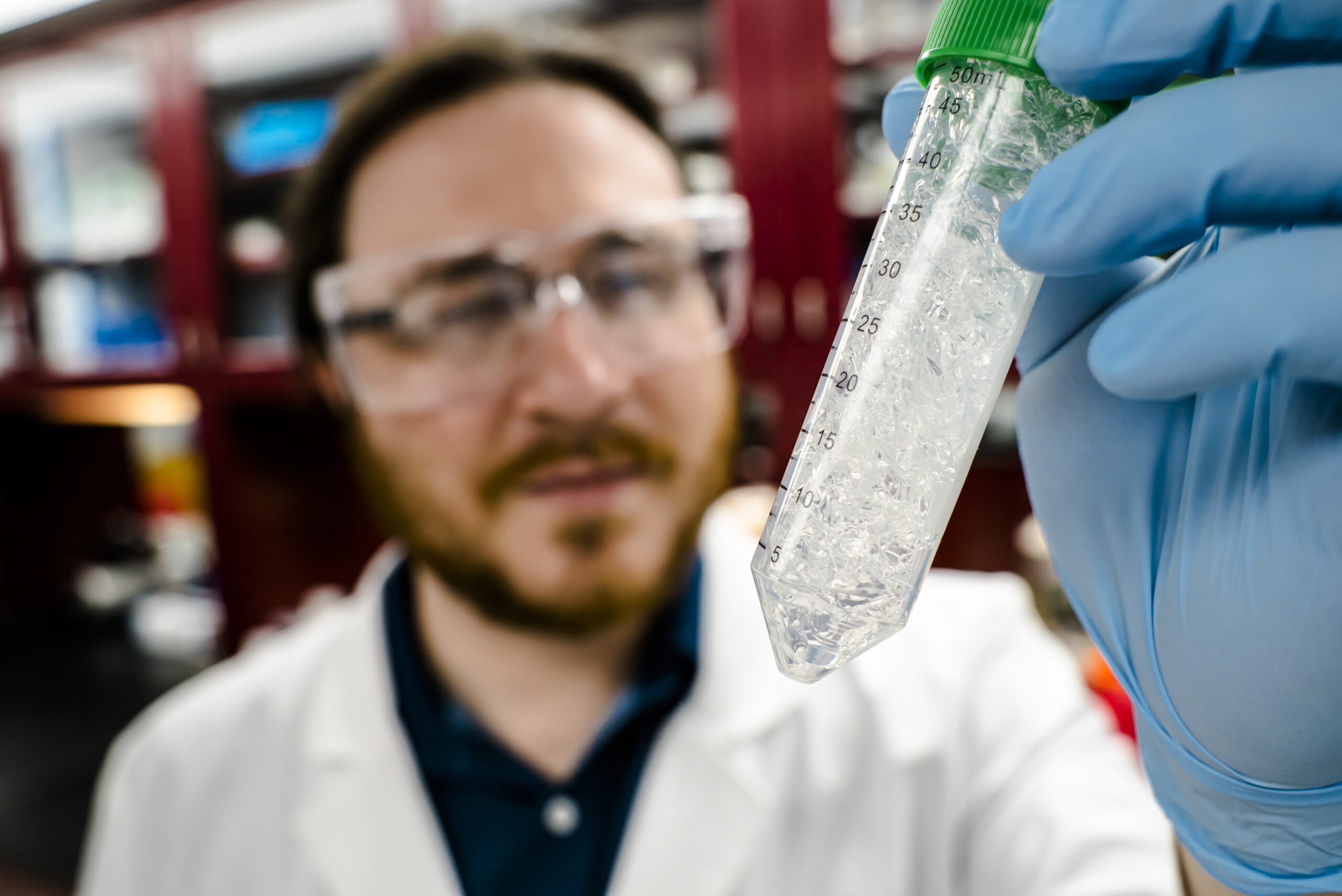 Jeremy Minty, a 2013 Ph.D. graduate of Michigan Engineering and co-founder of Ecovia Renewables, holds up a sample of the company's AzuraGel product in 2018. Minty participated in NSF's I-Corps program. Ecovia is developing a compostable biopolymer cosmetics. One of its uses could be in compostable diapers. Photo: Evan Dougherty/Michigan Engineering Communications & Marketing