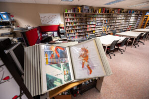 Print materials and promotional posters that come with the video, board and card games. Image credit: Eric Bronson, Michigan Photography