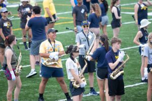 Happy band members practice on the field 2021