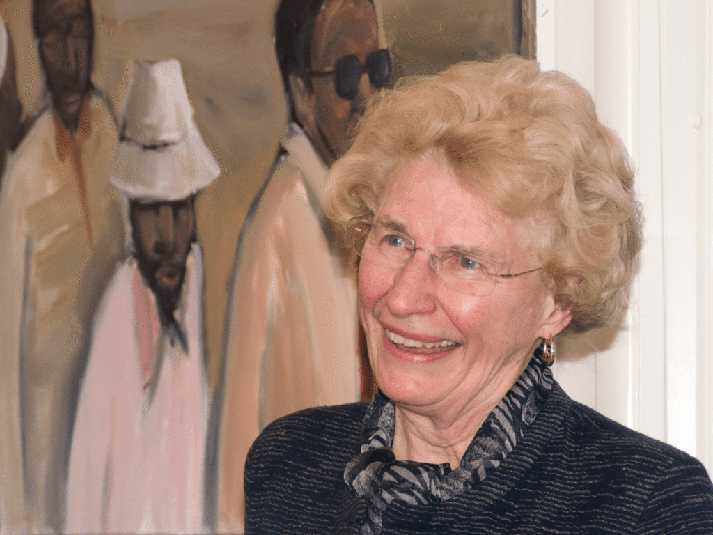 Picture of Ilene Forsyth in front of a painting