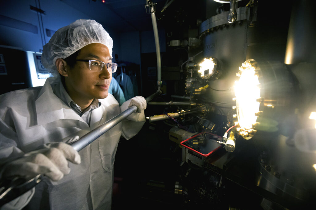 Zetian Mi, Professor of Electrical Engineering and Computer Science, produces a sample in the molecular beam epitaxy machine. Image credit: Joseph Xu, Michigan Engineering