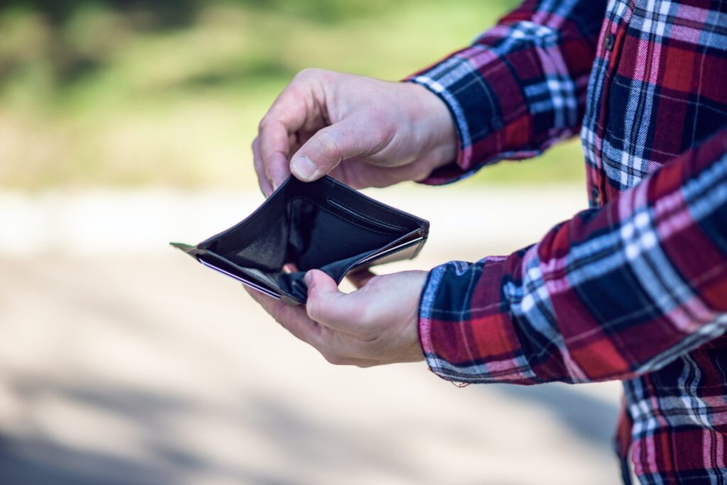 An empty wallet. Image credit: Emil Kalibradov via Unsplash