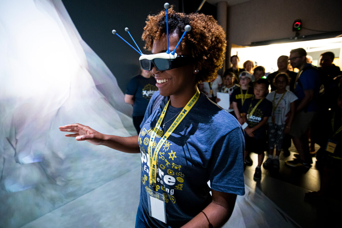 Prospective students explore the Michigan Immersive Digital Experience Nexus, or MIDEN, the Duderstadt Center’s immersive reality space, as part of an “Explore Engineering” event in 2019. (Photo by Joseph Xu, College of Engineering)