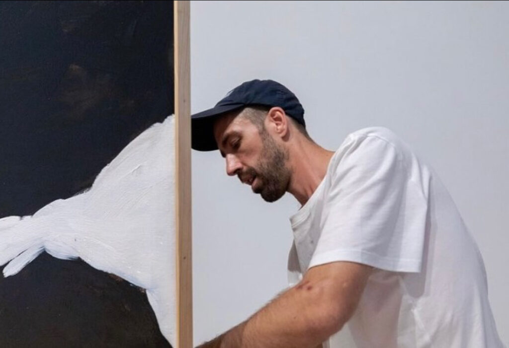 David Flaugher helps install a piece of artwork at the Eli & Edyth Broad Art Museum at Michigan State University as part of his first solo exhibition. (Photo courtesy of David Flaugher & Broad Art Museum)