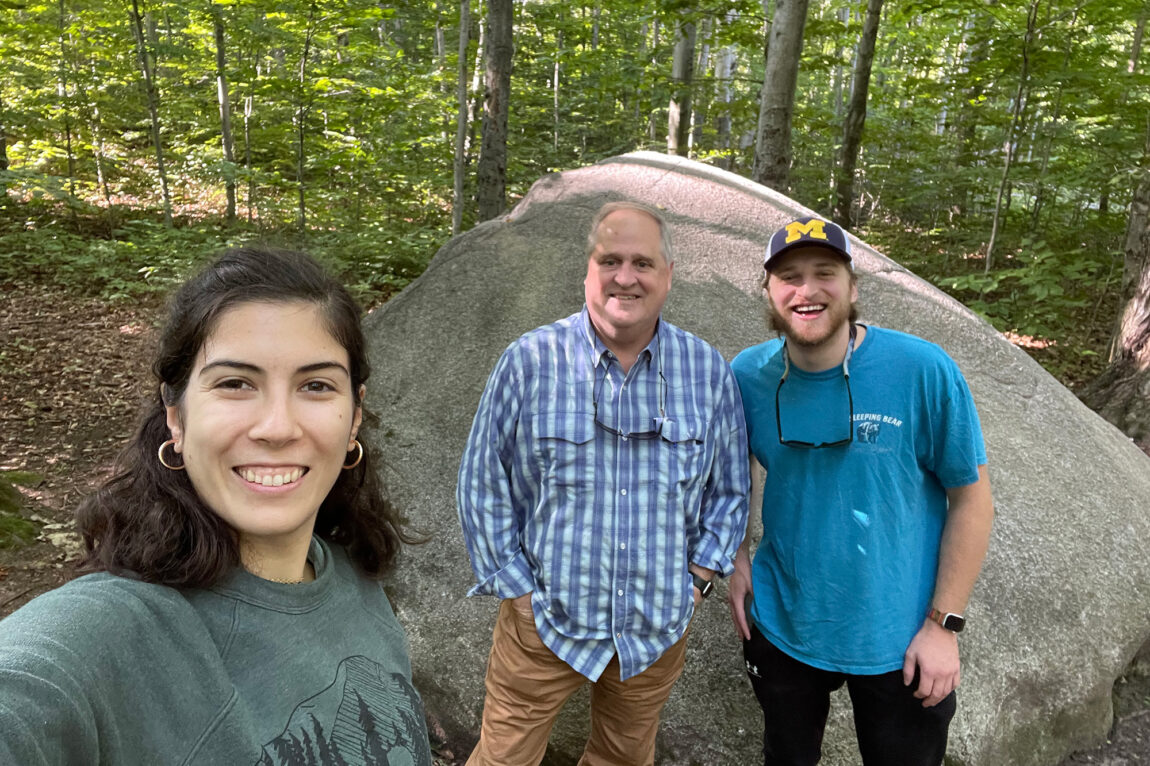Photo of SEAS graduate student Daniela Fernández Méndez Jiménez; Jon Allan, the academic and research program officer at SEAS; and SEAS graduate student Samuel Frederickson on Beaver Island