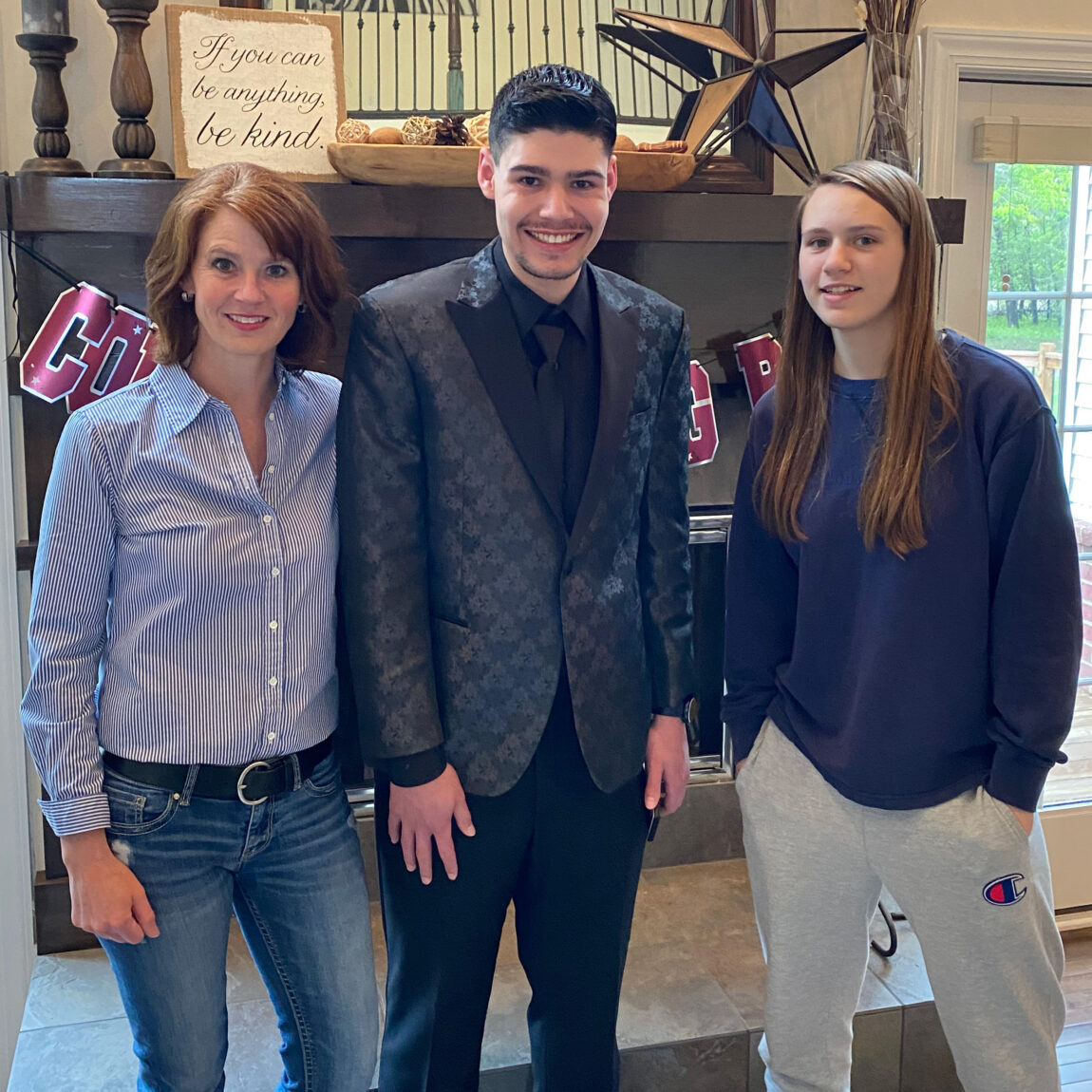 Kelly Miltimore, a registered nurse who works in the Central Staffing Resources at Michigan Medicine, stands next to her son, Liam, and daughter, Mira. (Courtesy of Kelly Miltimore)