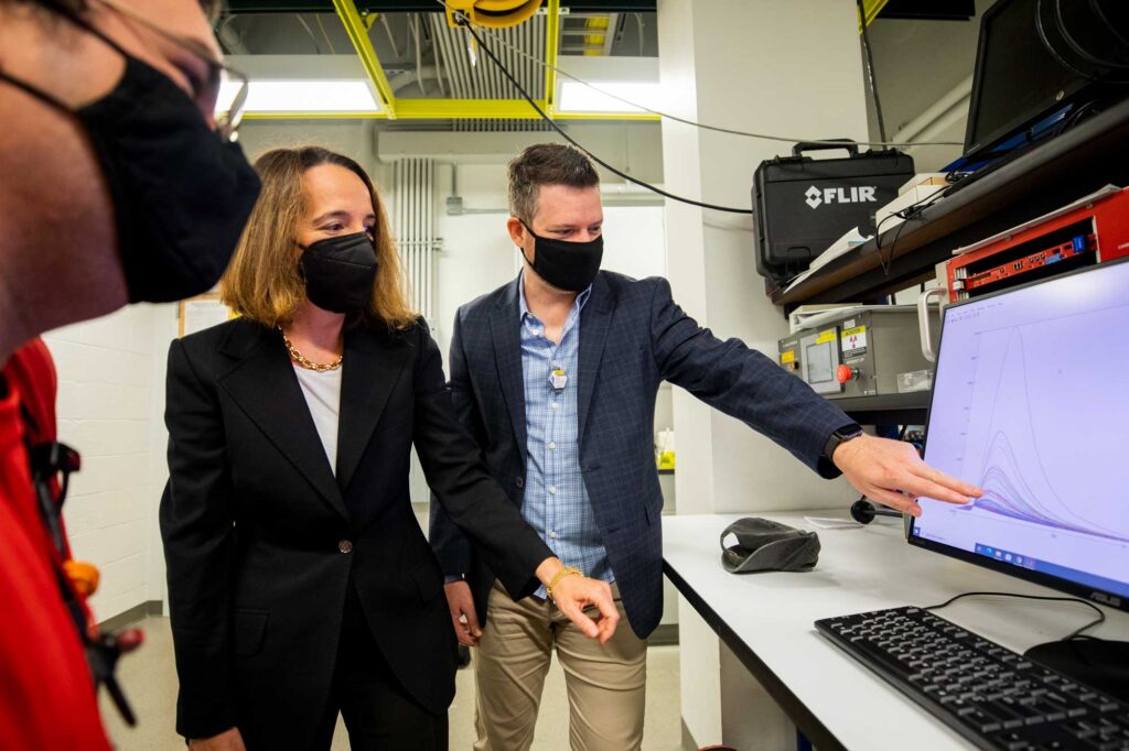 Christopher Meert (left), a graduate student in nuclear engineering and radiological sciences (NERS); Sara Pozzi (middle), a professor of NERS; and Shaun Clarke (right), an associate research scientist in NERS, develop algorithms that sift through the noisy data gathered by detectors. With smaller and more robust neutron sources now feasible for scanning cargo at ports and border crossings, the team’s algorithms may help detect the smuggling of materials that could be made into nuclear weapons. Image credit: Robert Coelius, Michigan Engineering