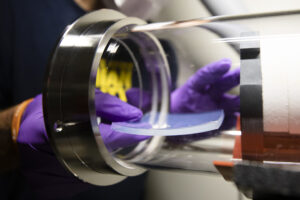 A solar-transparent, heat-trapping aerogel is placed into a test rig to demonstrate its use in solar-thermal power plants. Image credit: Evan Dougherty/Michigan Engineering