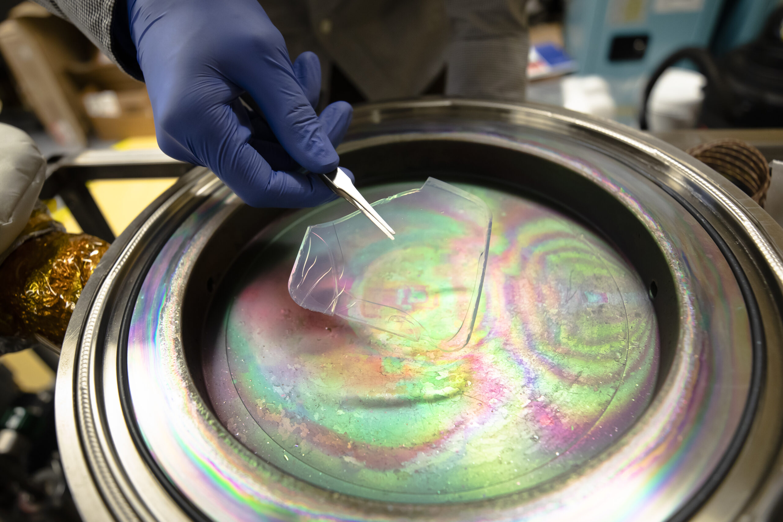 A solar-transparent aerogel is placed into a device that will apply an atom-thick coating for use in solar-thermal power plants. Image credit: Evan Dougherty/Michigan Engineering