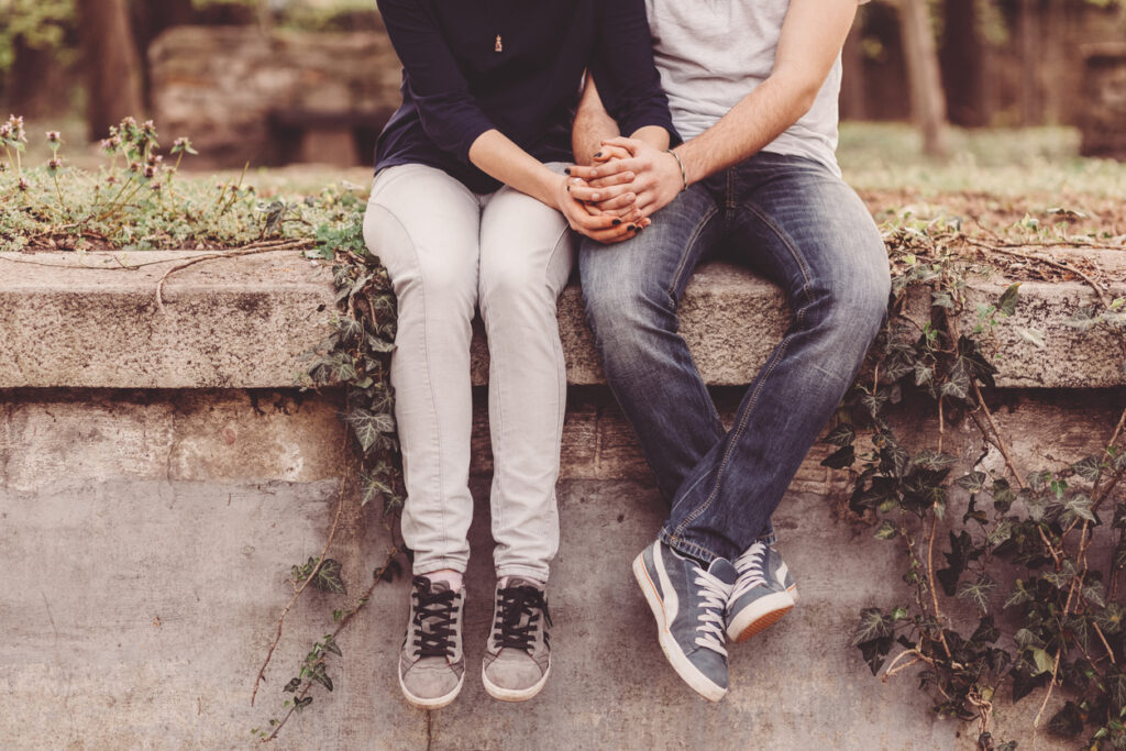 Cropped photo of young couple holding hands Image credit: iStock