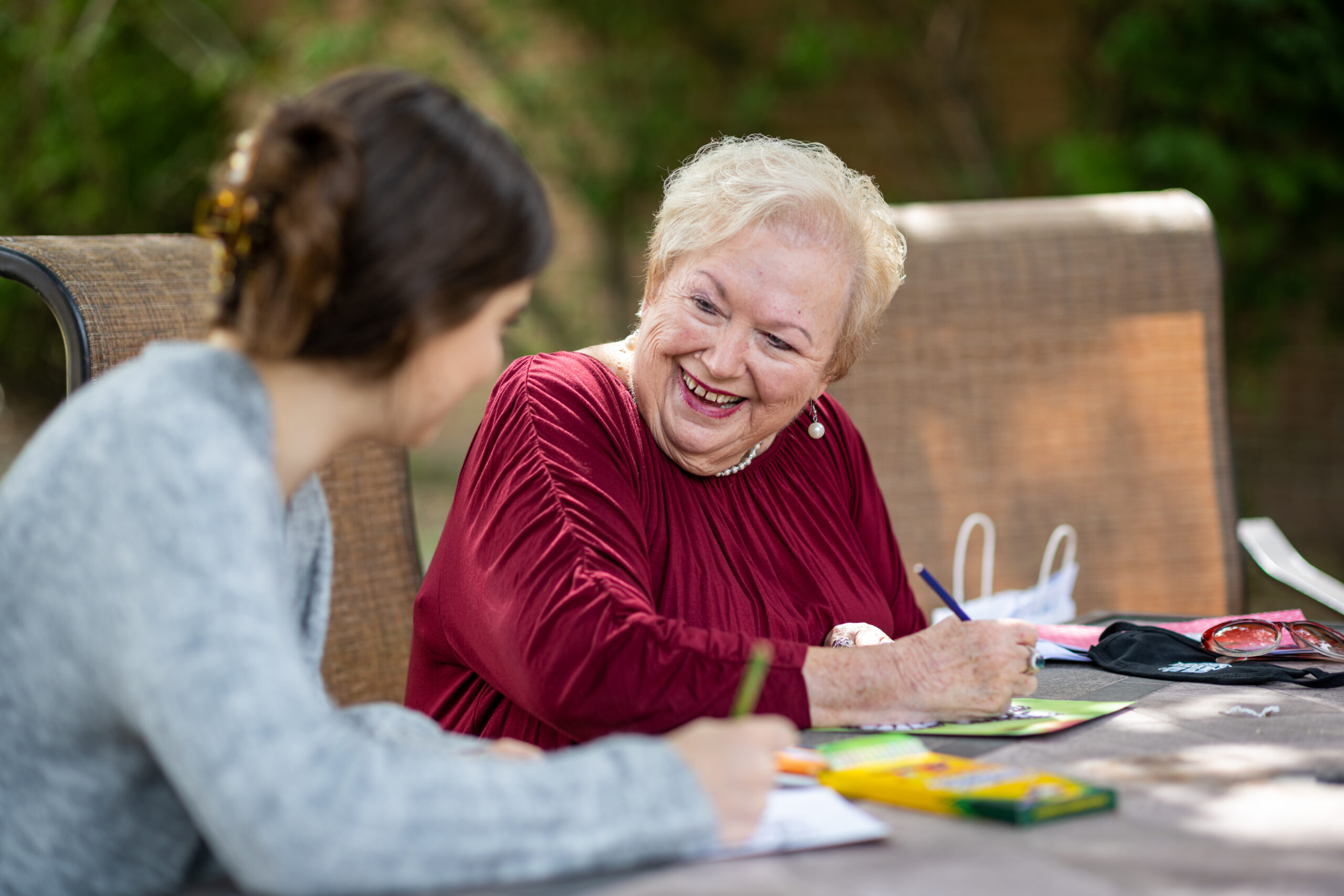 Lizzy Rueppel, left, a U-M public health student, and Bobbie Jean Gill, a resident at Hillside Terrace Senior Living, chat in person after months of virtual meetings.