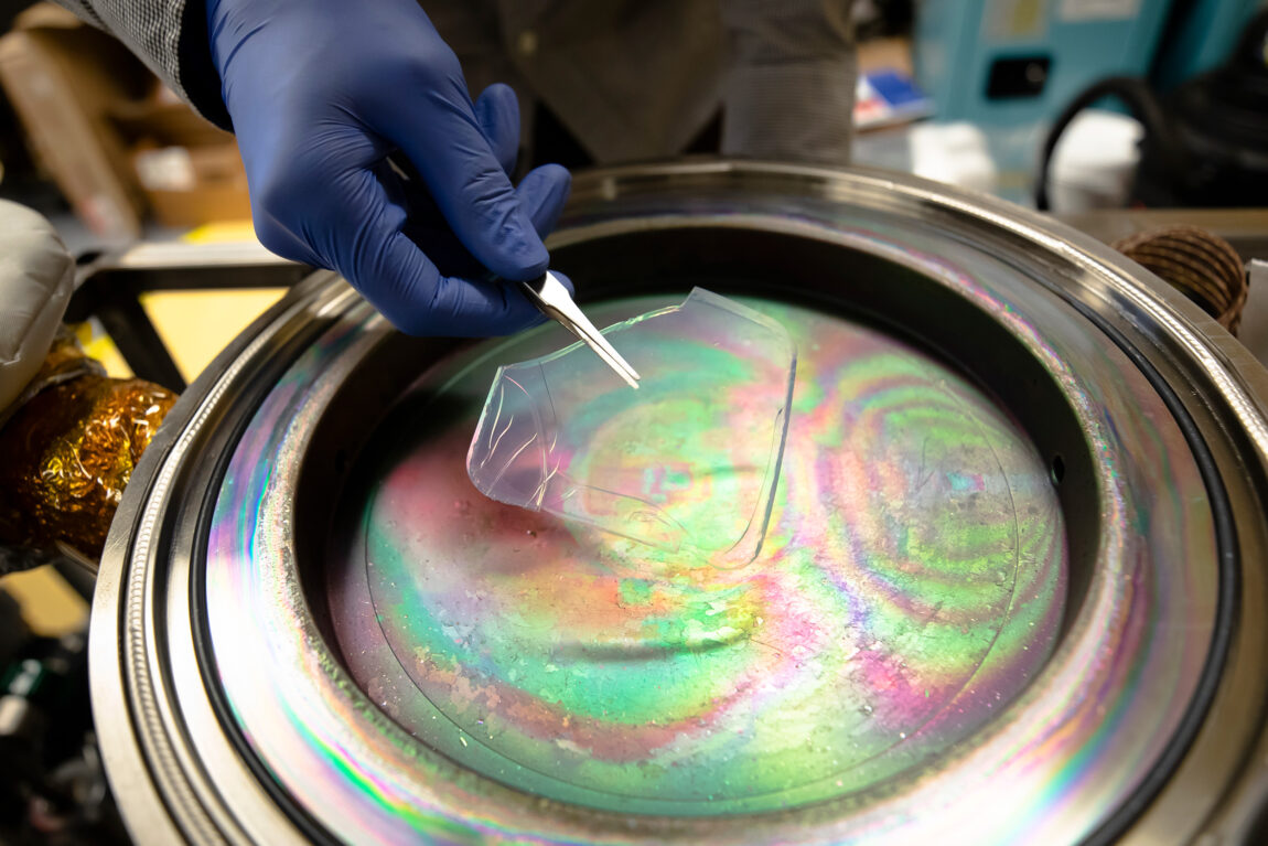 A solar-transparent aerogel is placed into a device that will apply an atom-thick coating for use in solar-thermal power plants. (Photo by Evan Dougherty, Michigan Engineering)