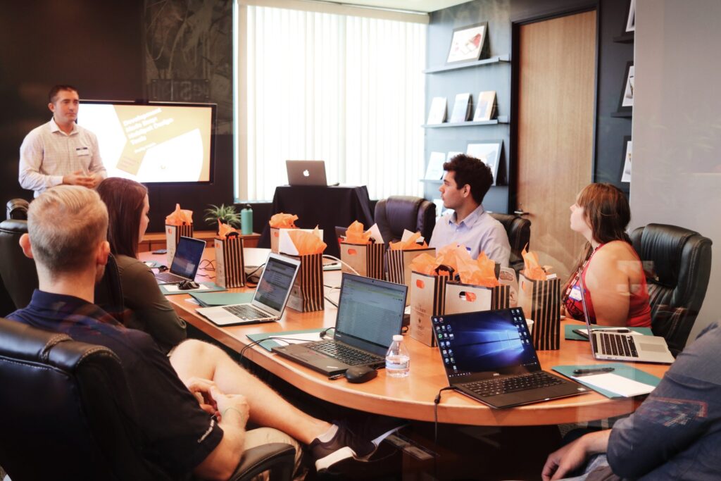 A group of professionals in a meeting. Image credit: Campaign Creators, Unsplash.com