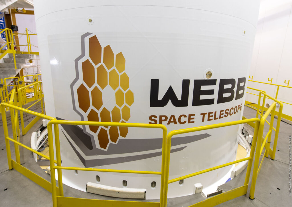 At Europe's Spaceport in French Guiana, the James Webb Space Telescope will soon be encapsulated inside this 17 meter-high, 5.4-meter diameter fairing, which will provide protection from the thermal, acoustic and aerodynamic stresses during the ascent to space. Image credit: ESA/CNES/Arianespace