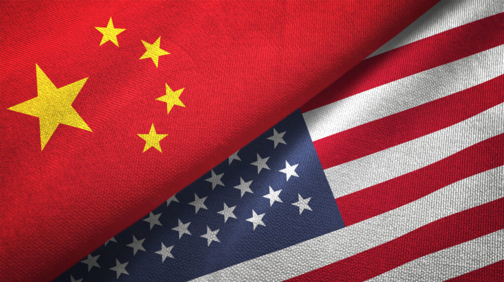 United States and China two flags together realations textile cloth fabric texture stock photo. Image credit: iStock