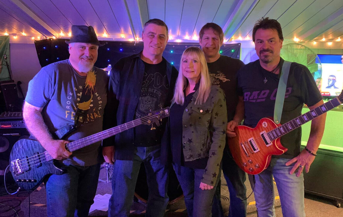Anne Kadrovich is pictured with members of Rock Squad. Kadrovich, the purchasing associate supervisor in Michigan Medicine’s Department of Psychiatry, has a long musical history and currently plays in two bands. (Photo courtesy of Anne Kadrovich)