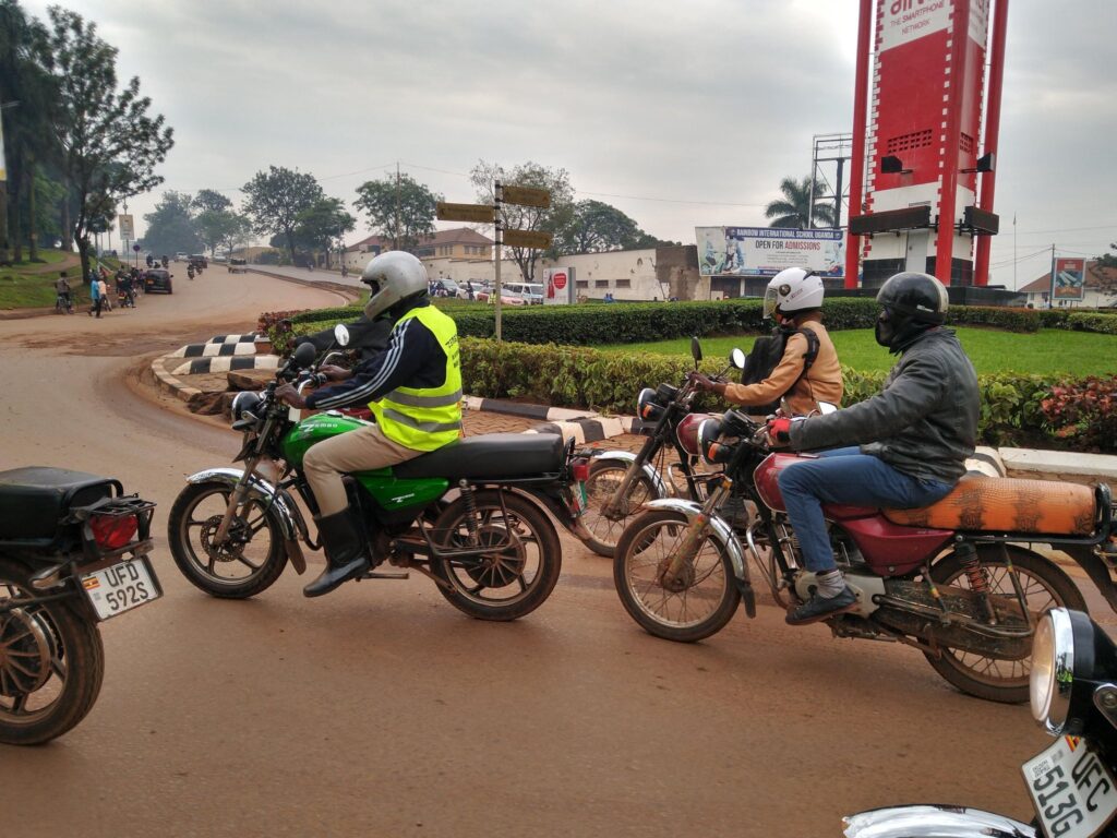 The green boda boda pictured is a Zembo bike. Zembo provided empirical data on trips and charging of their electric motorcycle taxis for this study. Image credit: Tom Courtright