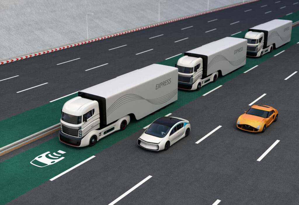 Autonomous hybrid trucks driving on wireless charging lane. Image credit: iStock