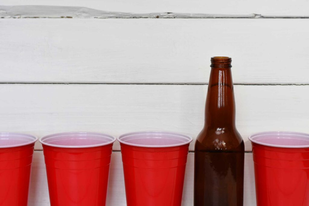 Red Solo cups and beer bottles. Image credit: iStock