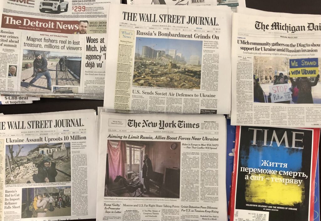 Newspapers showing headlines of the Russian invasion of Ukraine. Image credit: Jeff Karoub, Michigan News
