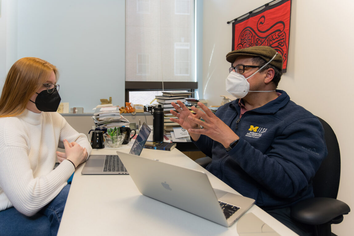 Elizabeth Tower, a junior majoring in international studies, talks with mentor Samer Ali, associate professor of Middle East studies in LSA. The two have been working together through the Undergraduate Research Opportunity Program. (Photo by Sean Carter)