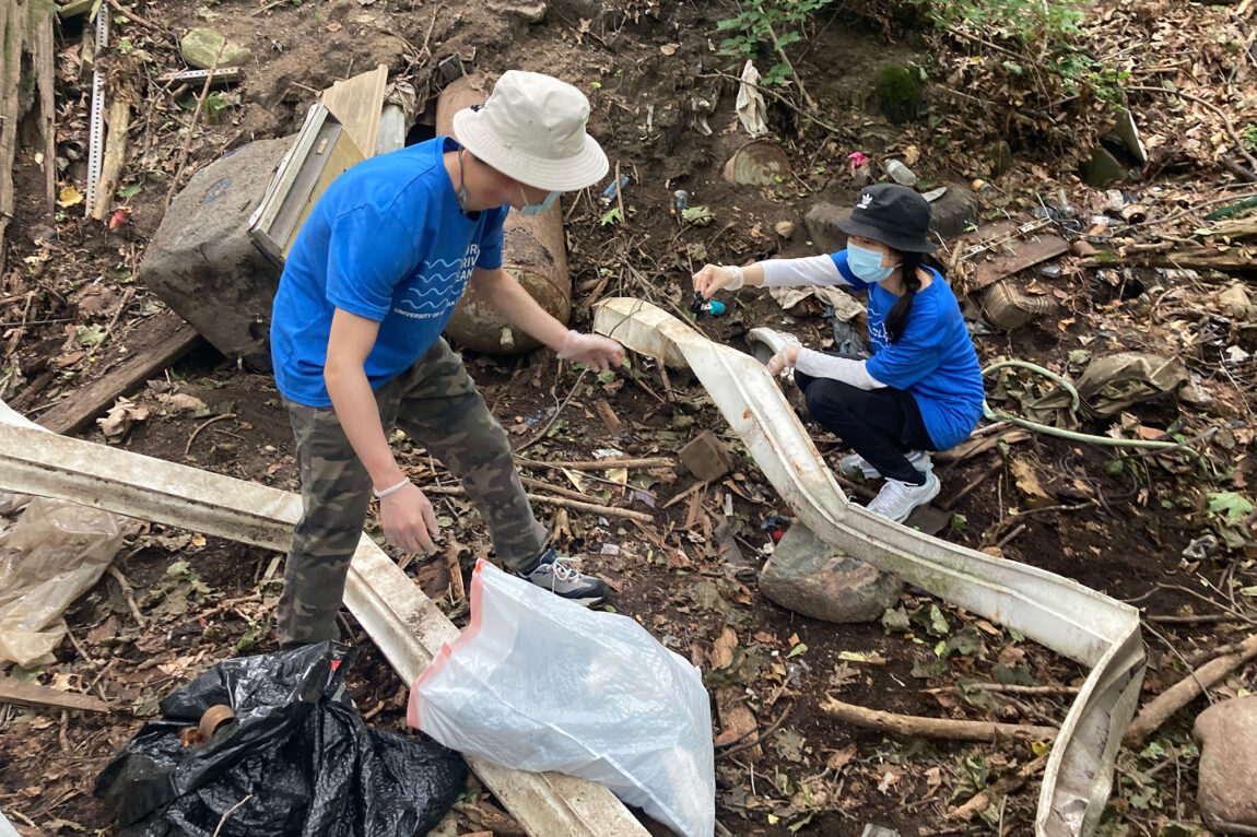 Photo of volunteers cleaning up Bluffs Nature Area in Ann Arbor during a September 2021 event.