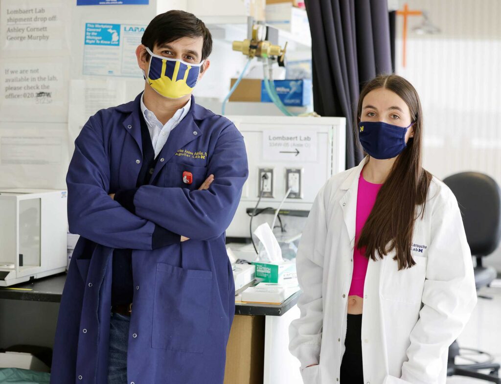 Portrait of Carlos Aguilar, left, a University of Michigan assistant professor in the Biomedical Engineering Department, and PhD graduate student Jacqueline Larouche at the North Campus Research Complex. Image credit: Brenda Ahearn