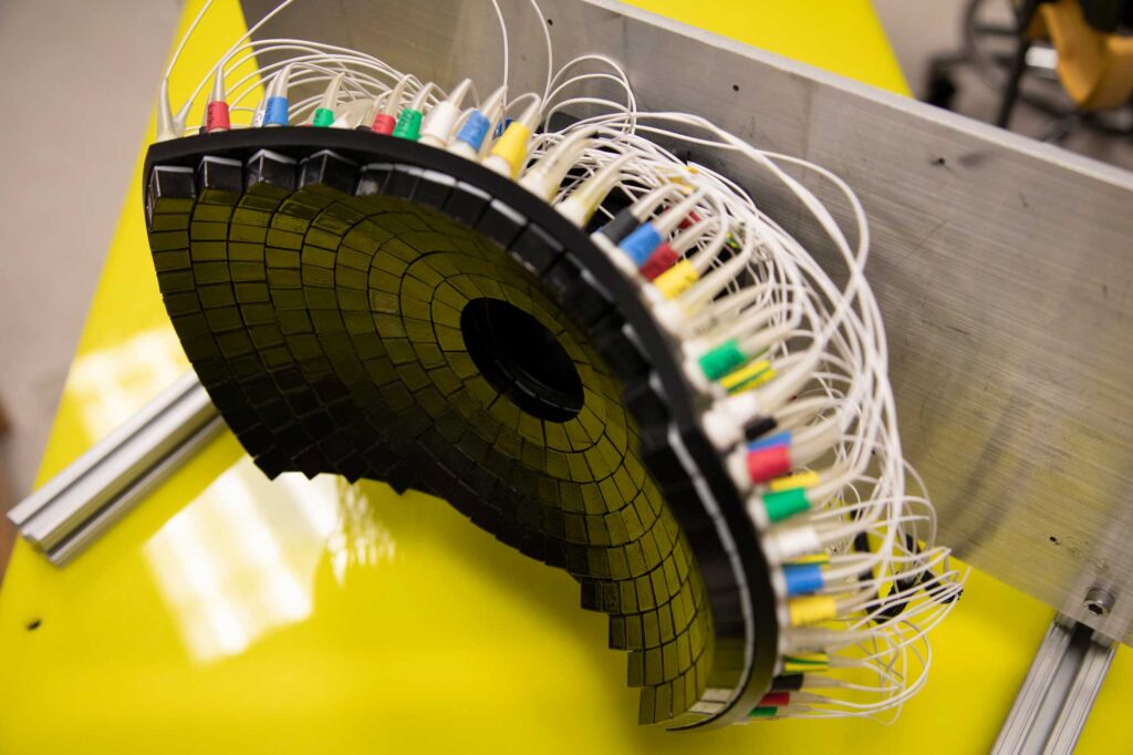 The 700kHz, 260-element histotripsy ultrasound array transducer used in Prof. Xu’s lab. Image credit: Marcin Szczepanski, Michigan Engineering