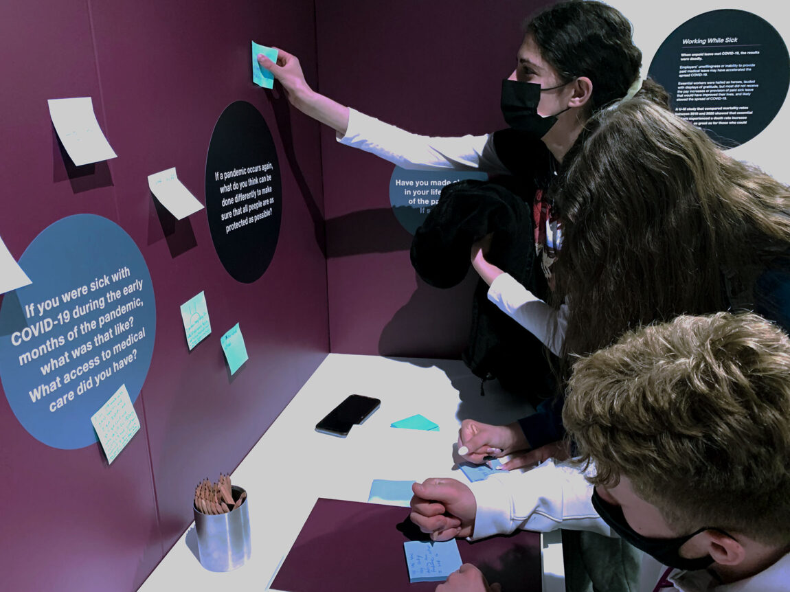 Photo of visitors interacting with exhibit