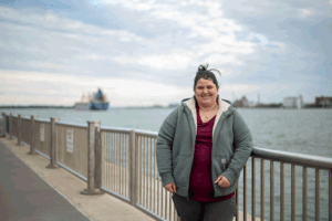 Amie Turner says her favorite thing about the Riverwalk is “looking over the water and seeing Canada, like it is the coolest thing.” Image credit: Eric Bronson, Michigan Photography