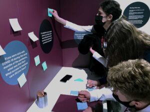 Visitors are invited to share their pandemic experiences in the feedback station of the “Facing the Pandemic” exhibit.