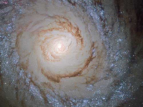 M94 is a spiral galaxy located 16 million light-years away in the constellation Canes Venatici. University of Michigan doctoral student Katya Gozman investigated the galaxy's halo to examine the galaxy's merger history. Image credits: ESA/Hubble & NASA