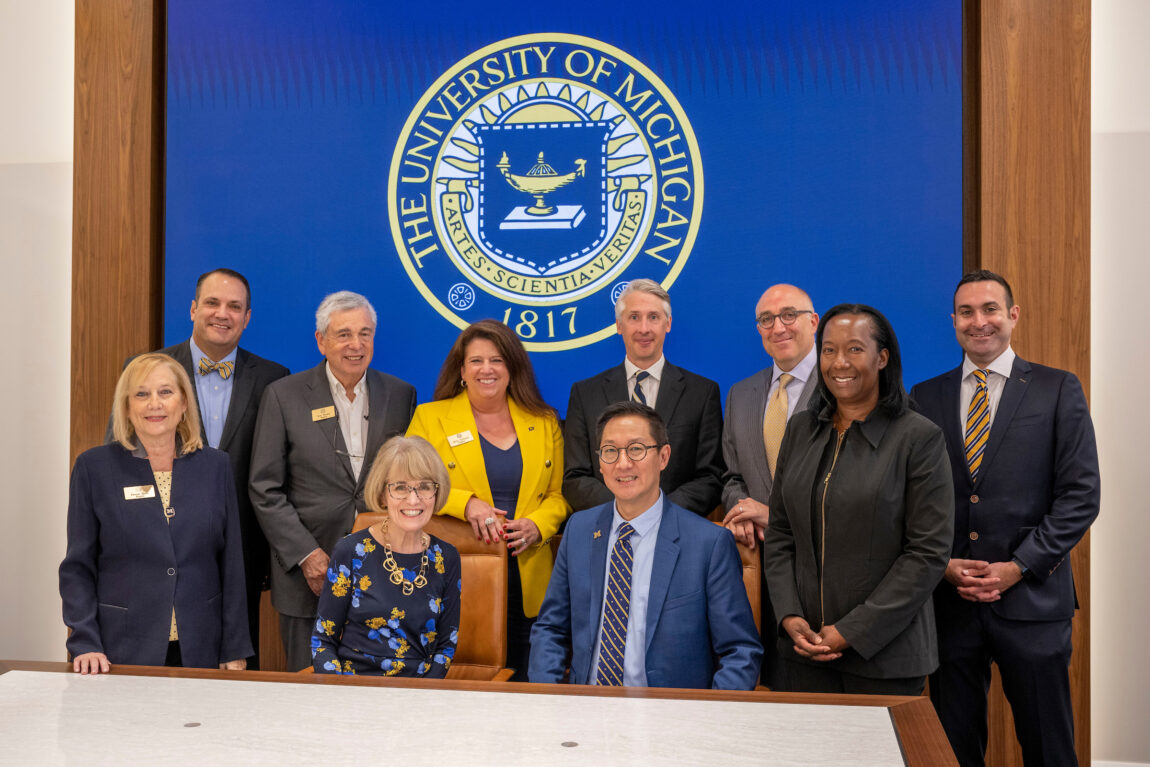 President-elect Santa Ono, seated at right, is shown with President Mary Sue Coleman, and Regents, from left, Denise Ilitch, Michael Behm, Ron Weiser, Sarah Hubbard, Paul Brown, Mark Bernstein, Katherine White and Jordan Acker. (Roger Hart, Michigan Photography)